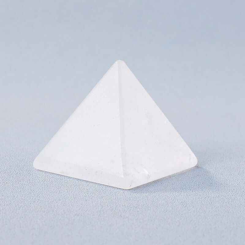 Crystal stone pyramid ornament for meditation and mindfulness, energy generator with modern geometric design.