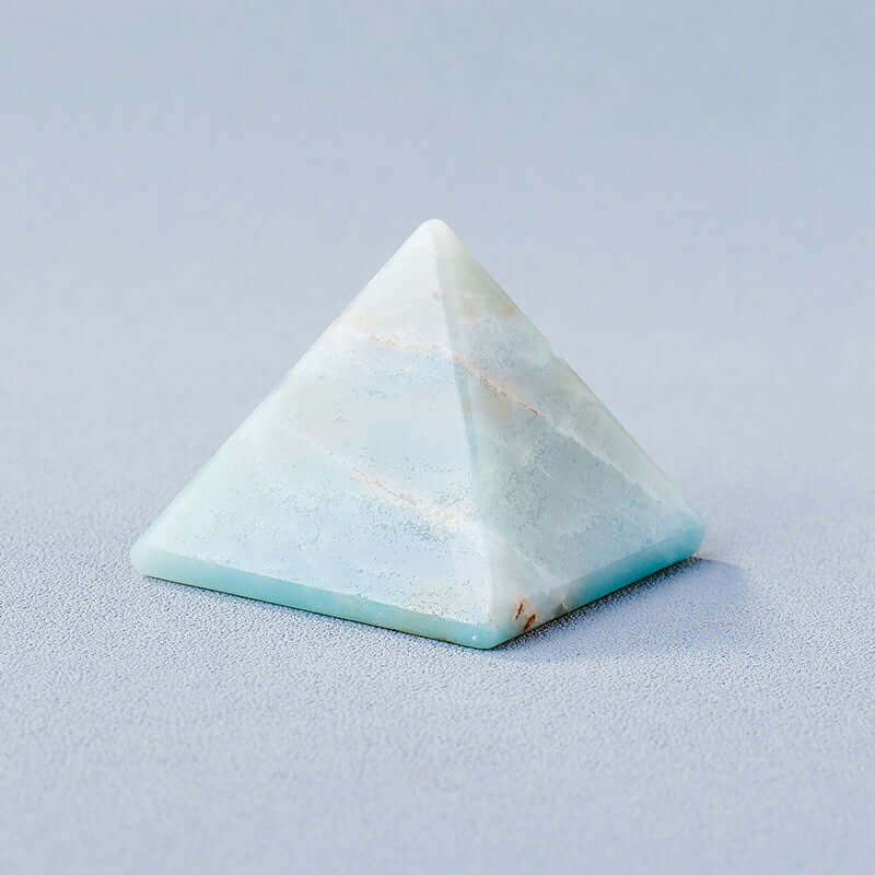 Geometric crystal pyramid ornament for meditation and mindfulness, made from natural stone, energy generator.