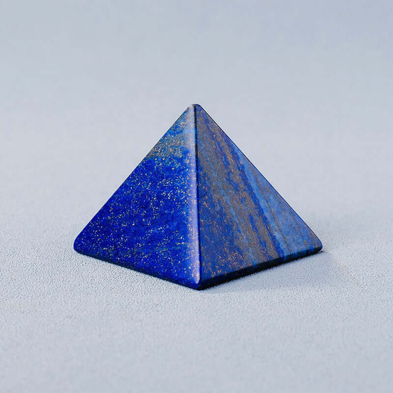 Blue crystal stone pyramid ornament for meditation and energy balance.