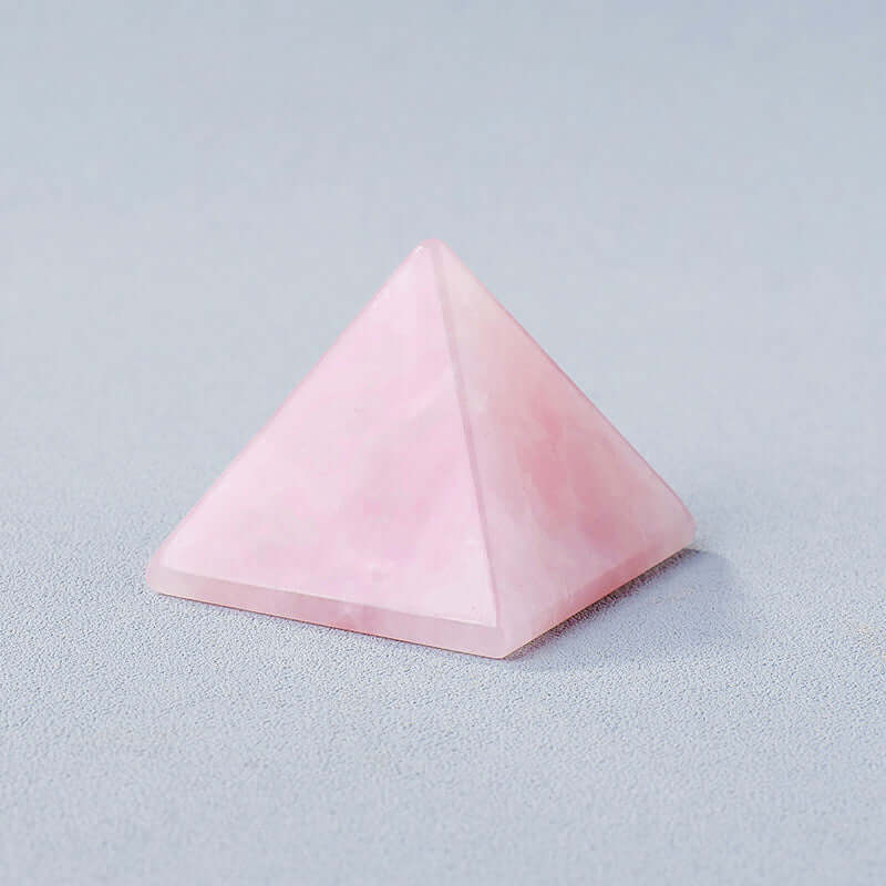 Rose quartz crystal stone pyramid for meditation and mindfulness energy generation