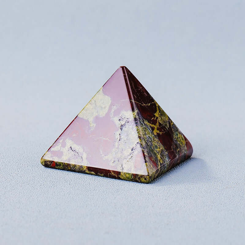 Geometric stone pyramid ornament made from polished natural crystal, ideal for meditation and mindfulness energy generation.