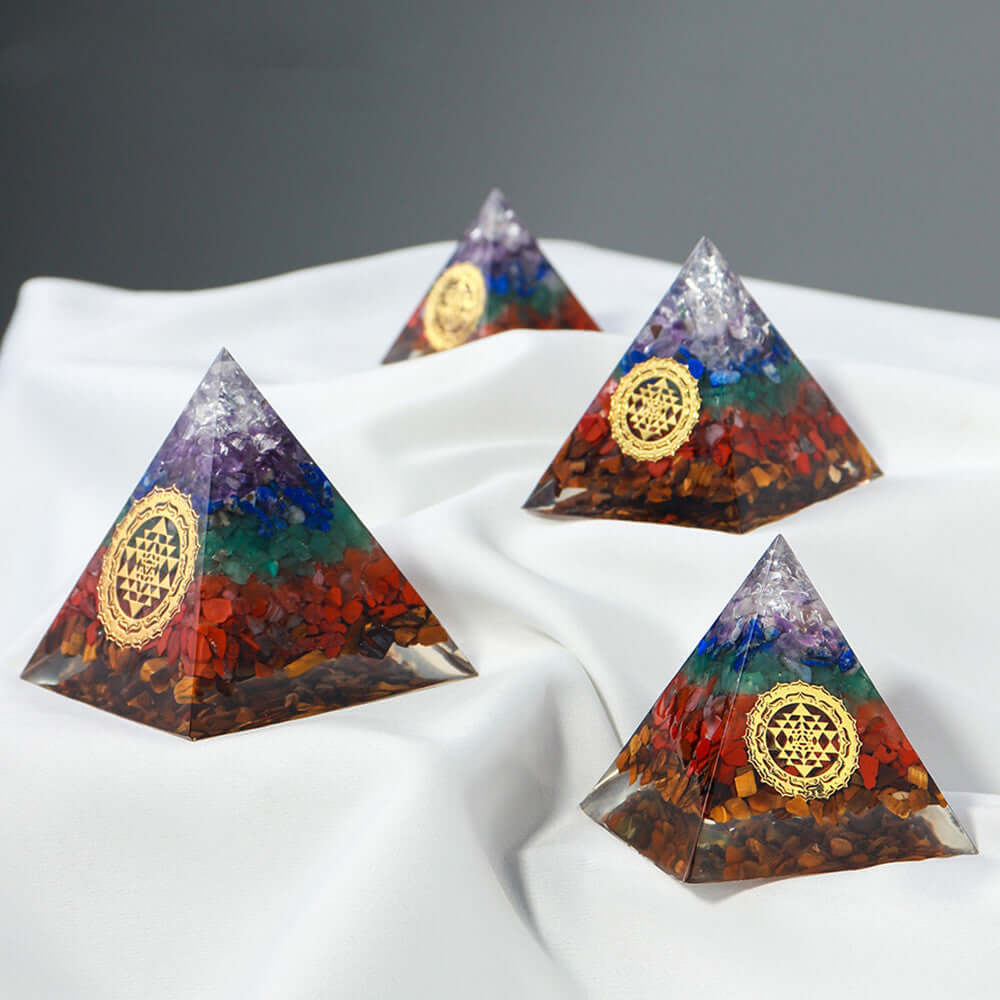 Decorative crystal stone pyramids for energy healing, featuring vibrant colors and geometric design, perfect as a modern space enhancer.